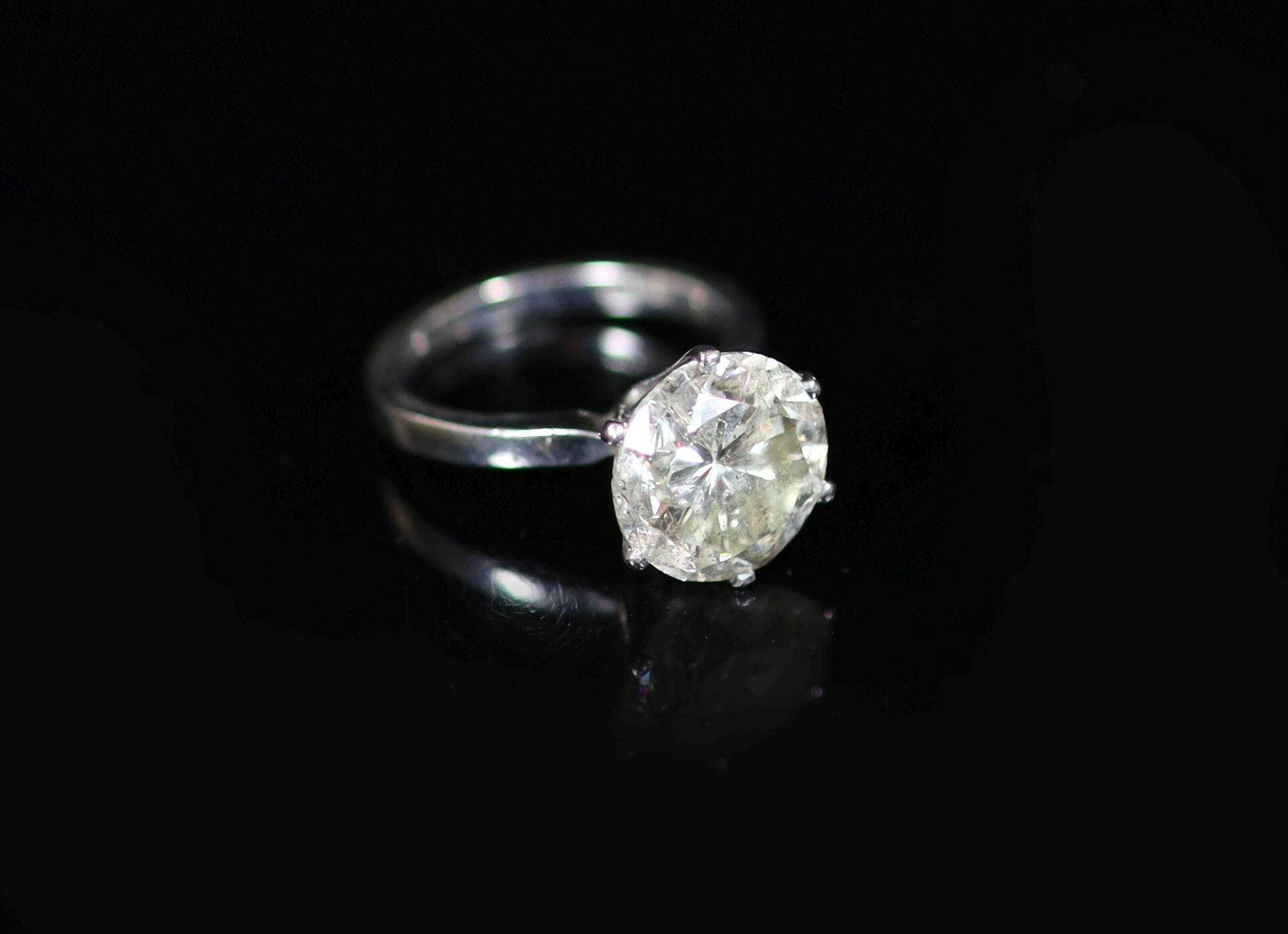 A modern 18ct white gold and solitaire diamond ring